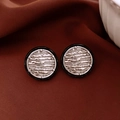 Vintage round stud earrings in black and silver with a red textured fabric background - 50# Black Silver - Retro Brushed Round (Silver Earring Post)