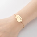 Elegant gold bracelet with an abstract face outline pendant on a delicate chain - 366-Abstract Face