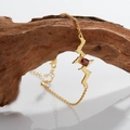 Macro view of gold silver necklace with red gemstone and heartbeat wave on wood - Gold Natural Garnet Bracelet
