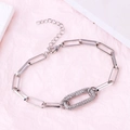 Silver interlinked geometric chain bracelet with clear cubic zirconia oval center link - Oval Platinum Plated Bracelet