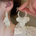 Detail shot of elegant floral pearl hoop earrings with shimmering white shell petal fringe - 4# 925 Sterling Silver Earring Post - Gold/White Pearl Large Hoop Tassel Style