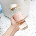Pink leather sleeve glass water bottle with beige lid and strawberry slices inside - 16oz / With Tea Infuser / Pink