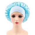 Detailed view of light blue satin sleep bonnet featuring wide elastic band on a mannequin - One Size / Light Blue