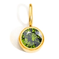 Detailed macro view of a gold-plated round birthstone pendant with faceted green crystal - August - Light Green - Steel Color
