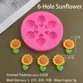 Detailed view of pink 6-hole sunflower silicone mold with finished floral resin pieces - 6-Hole Sunflower