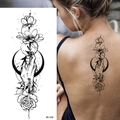 Sketch rose and crescent moon temporary tattoo sticker BK-030 shown on woman's back - Pattern BK-030