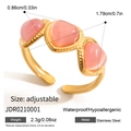 Detail of adjustable golden stainless steel wave ring with pink cat-eye gemstones - Pink Heart Cat's Eye Gold Open Ring (JDR0210001)