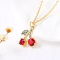 Detail of gold cherry pendant necklace with red crystals and green rhinestone leaves - Style B-Red Gem Micro-pave Zirconia