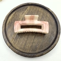Pink marble pattern square claw clip for hair styling shown on a dark wooden tray - Type D Square