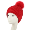 Red thick cable knit beanie with a large faux fur pompom shown on a white mannequin head - L (58-60cm) / Red