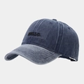 Close-up of black HELLO embroidery on washed blue denim vintage baseball cap - Adjustable / Navy Blue