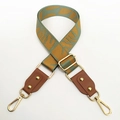 Detail of jacquard leaf pattern bag strap with brown leather and gold metal hooks - No.5 Yellow Leaf Jacquard + Brown Leather