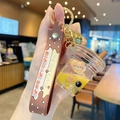 Bubble tea keychain with a cute brown bear floating in yellow liquid inside a miniature cup - Bear Milk Tea - Cup Style