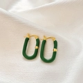 Macro detail of U-shaped gold earrings with green enamel on white silk background - Dark Green
