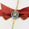 Gold-plated chain bracelet with circular abalone shell pendant featuring initial letter W - Letter W