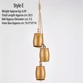 Three-piece vintage gold metal bells set hanging on natural hemp rope for holiday decor - Cow Bell Style E