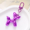 Detailed view of a purple acrylic balloon dog keychain with glossy electroplated finish - Deep purple