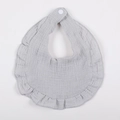 Detail of grey muslin cotton baby bib with ruffled petal edges and white snap fastener - Gray