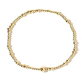 Minimalist gold beaded bracelet featuring mixed sized metallic spheres on white background - Single Bead Central Accent Style (JS-B24030901A)