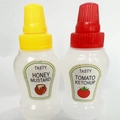 Mini condiment squeeze bottles with red and yellow lids for honey mustard and ketchup - New Label (Honey & Ketchup)