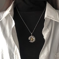 Daisy pendant necklace with silver beaded chain shown on model with layered clothing - Daisy Necklace
