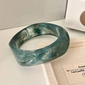 Detailed texture of a dark green resin bangle with artistic marbled patterns and marble finish - Geometric Rhombus / Inner Diameter 65mm / Cyan Marble