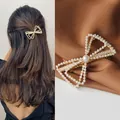Elegant gold bow hair clip with white pearls and rhinestones shown on model and flat lay - Double-Layer 3D Pearl Spring Clip