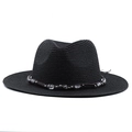Close-up of black straw fedora hat featuring a beaded decorative band with silver accents - Black