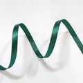 Macro shot of dark green satin ribbon with glossy finish and wavy texture for gift wrapping - Thin Solid Christmas Green (1cm Width 5m Length)