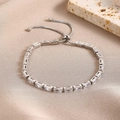 Silver adjustable bracelet featuring rectangular zircons on a champagne satin background - Silver Rectangle Zirconia Bolo Bracelet (0191-Gold)