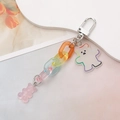 Close-up of pink gummy bear and acrylic bear charms on a colorful gradient chain - Colorful