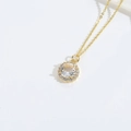Elegant gold necklace featuring a circular halo pendant with a central cubic zirconia - White