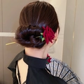 Classic red rose hair pin with golden stem shown elegantly on a model's braided hair - 117# Deep Red (Fabric Rose)
