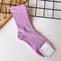 Detailed view of a purple ribbed cotton sock with a rolled edge and professional brand tag - One Size / Purple