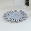 Detailed view of grey hand-woven cotton rope coaster with intricate looped edge craft - Light Gray