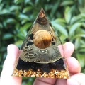 Tiger eye crystal ball resin pyramid with clock gears and gold foil held in hand - XQK11 Tiger Eye Clock