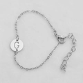 Silver chain bracelet featuring a circular pendant with the letter G engraving - Silver G