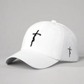 White cotton baseball cap with black faith embroidery and cross detail, 45-degree studio view - One Size / White