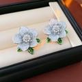 Silver needle stud earrings featuring light blue flower petals with green enamel leaves - 18K Gold Plated Crystal Flower Studs with Silver Earring Post