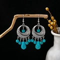 Macro shot of retro bohemian earrings with turquoise beads and antique silver tassels - E4289-2/Hollow Ring Tassel Teardrop Main Stone