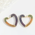 Detail of gold heart earrings paved with purple, green, orange, and red zircon stones - Heart