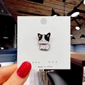 Close-up of a cute black and white cartoon dog enamel pin on a white card display - 20*Black and White Dog Pin
