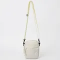 Minimalist cream canvas crossbody bag with adjustable black strap and front zipper pocket - White