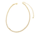 Detail of gold tennis necklace with bezel-set round cubic zirconia and lobster clasp - White
