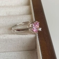 Silver finish ring featuring a pink heart-shaped gemstone and small clear side diamond - Single Pink Heart Fashion Ring (J2757)
