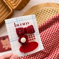 Close-up of a 3-piece set of red fabric bow hair clips for girls on display card - Red Flower & Tweed Set 3Pcs