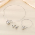 Three-piece silver stainless steel jewelry set featuring hollow ball pendants on silk background - Silver Jewelry Set (KS220614-Z)