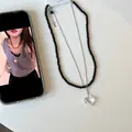 Double-layered beaded necklace with a transparent heart pendant and black beads - Layered Glass Bead Black Necklace