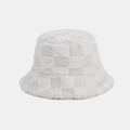 Close-up of soft plush checkered bucket hat showing thick faux fur texture and beige pattern - M / White