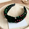 Detail of dark green velvet headband featuring colorful rhinestones and faux pearls - Rhinestone Green